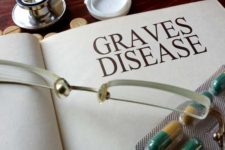 Book with diagnosis Graves disease and pills.