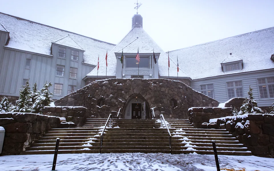 The entrance to Timberline Lodge pictured in a snowstorm.