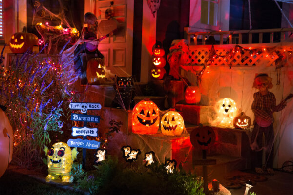 A house with Halloween pumpkins and Halloween decorations are seen in this stock photo.