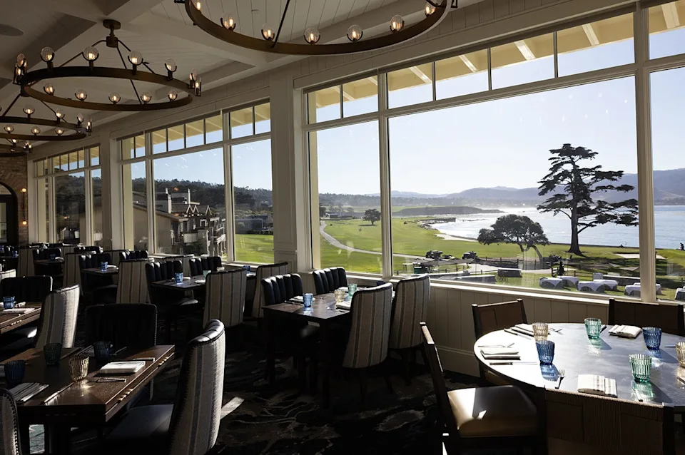 The recently renovated Stillwater restaurant at Pebble Beach Resorts in California offers floor-to-ceiling views across Pebble Beach Golf Links to the Pacific Ocean beyond.