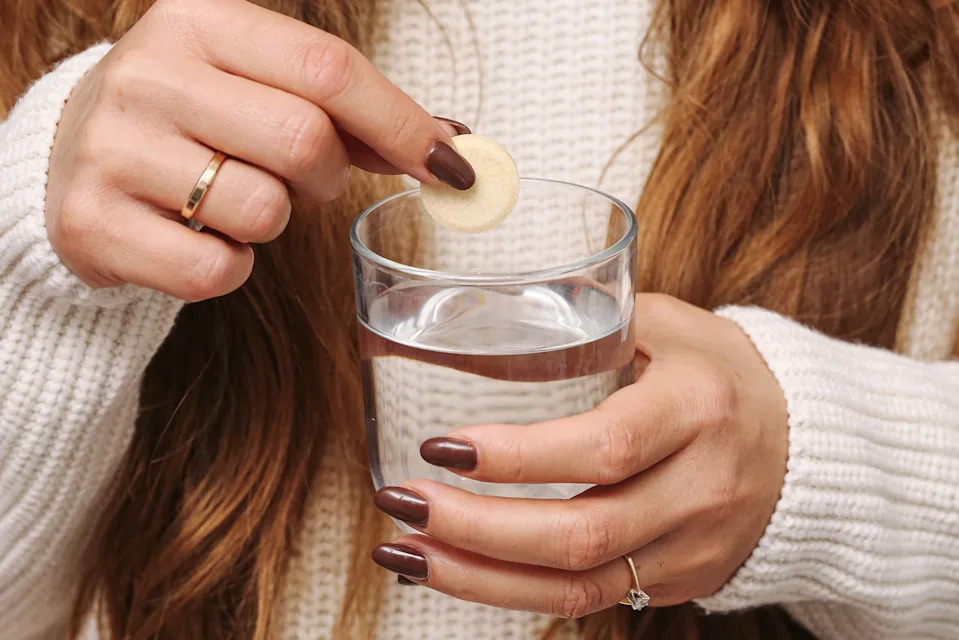 Healthy lifestyle and hydration. Hands detail on neutral background close up.
