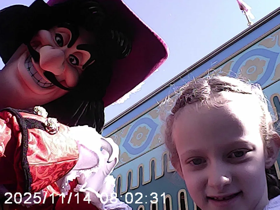 a character dressed in elaborate costume interacting with a child