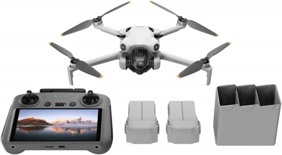 Photo of DJI drone, remote and batteries.