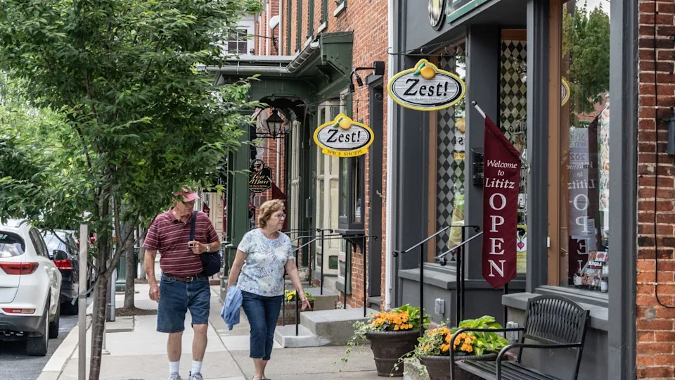 Lititz, Pennsylvania-June 1, 2022: Senior couple waking on Main Street, Lititz, Pennsylvania.