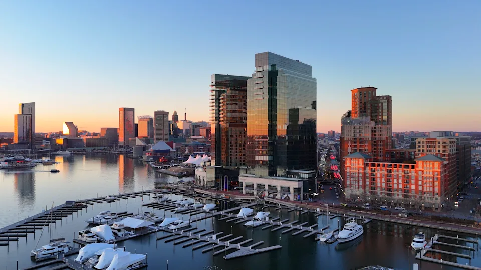 The Baltimore harbor from a vantage point that gives access to witness the prominent sightline of a beautiful skyline that fulfills the qualities of a dynamic scenery through the varied range, shape, and characteristics of structures that create a definitive and distinctive visibility across the region.