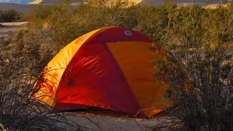 Red and orange dome tent pitched in Red Rock Canyon NCA
