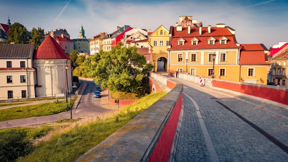 Attractive summer cityscape of Lublin town, Poland, Europe. Breathtaking morning view of Old Town with tourist attraction - empty Arcade Viaduct. Traveling concept background.