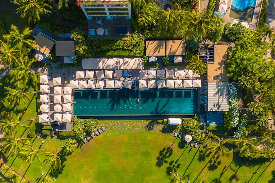 Eric Rubens Aerial view of guests enjoying a pool at the resort.