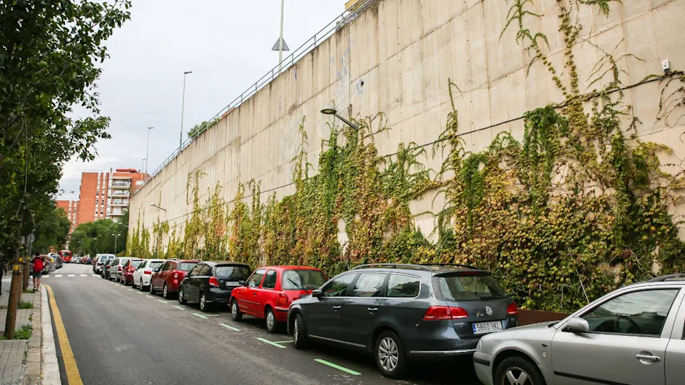 BARCELONA, SPAIN - OCTOBER 15, 2018: Modern Spanish streets in Barcelona. City life. Many cars are parked at outdoor parking.