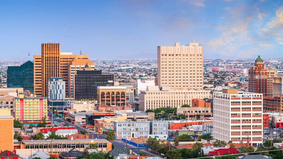 El Paso, Texas, USA downtown city skyline at dusk with Juarez, Mexico in the distance.
