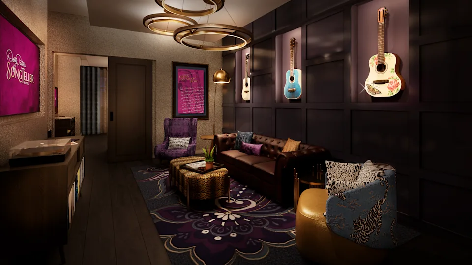 A living room with rich purple colors and guitars hanging on the wall