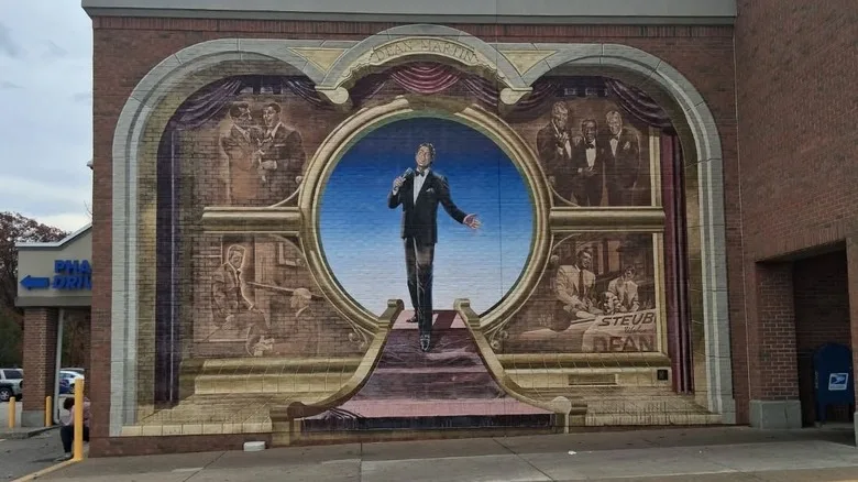 Dean Martin mural painted on a tan brick wall in Steubenville, Ohio