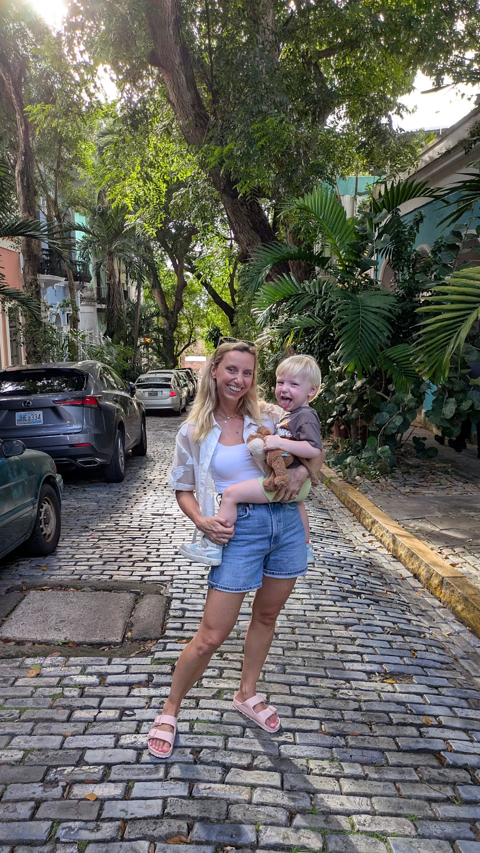 The author and her son standing on a street in Puerto Rico.
