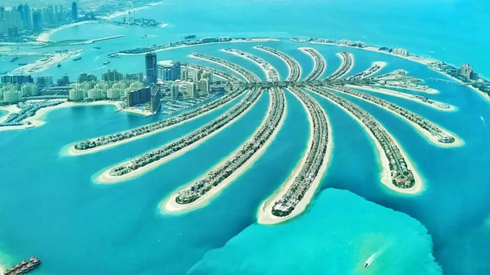 An aerial view of the Palm Jumeirah artificial island which resembles a stylized palm tree in Dubai, United Arab Emirates