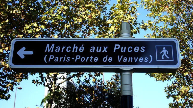 A sign leading to the Les Puces des Vanves Flea Market in the Vanves suburb of Paris, France