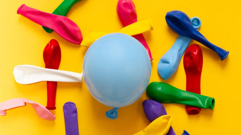 Colorful balloons on a yellow background