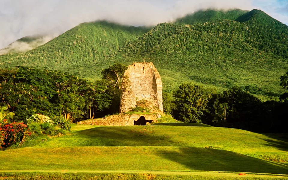Sugar mill with extinct Nevis Peak volcano, Nevis