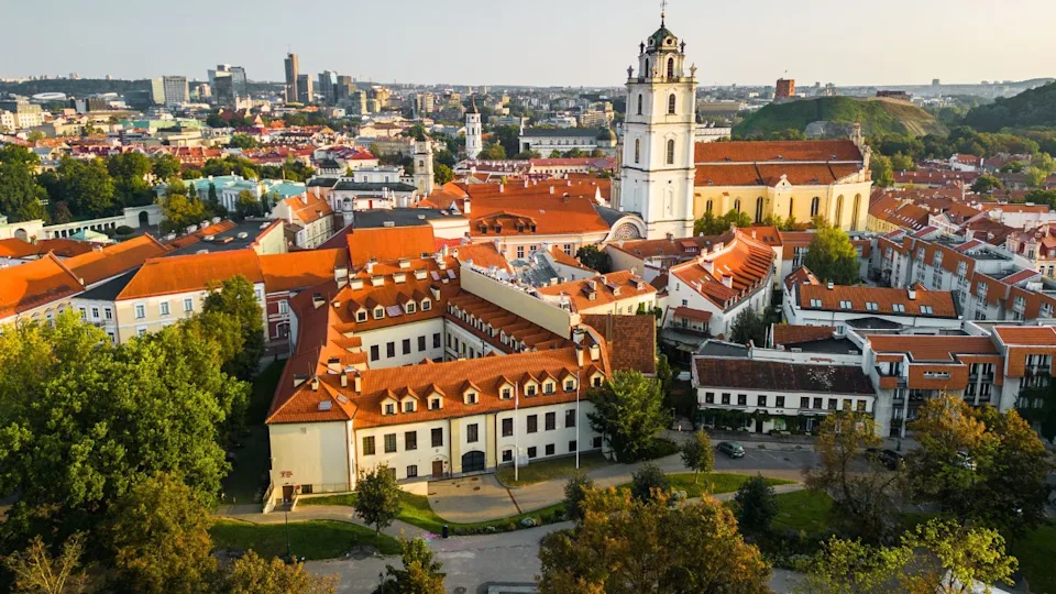 Aerial View of Vilnius Old Town With The University Bell Tower Above the Horizon