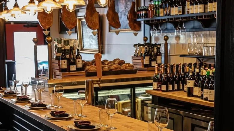 Malagon interiors with places set at a high bar