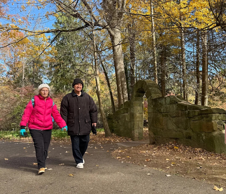 Martha Burke, 70, and Jim Burke, 78, of North Canton walk past an historic stone arch at Quail Hollow Park near Hartville in Stark County.