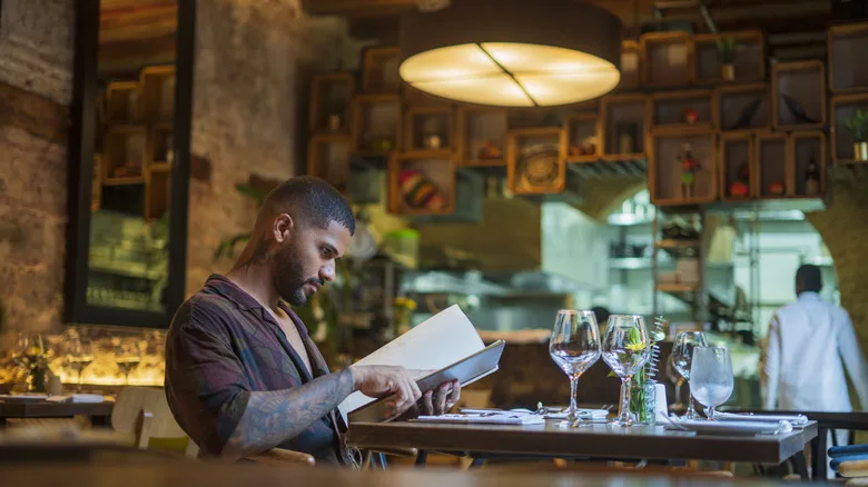 diner looking at menu