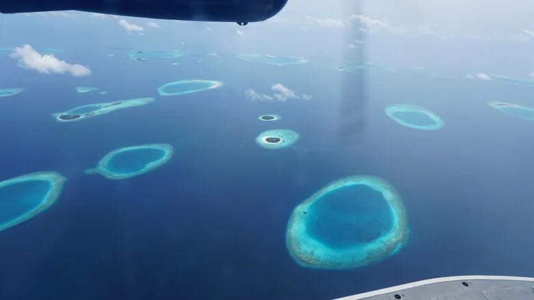 Stunning aerial view of the maldives archipelago, showcasing its unique ring-shaped atolls