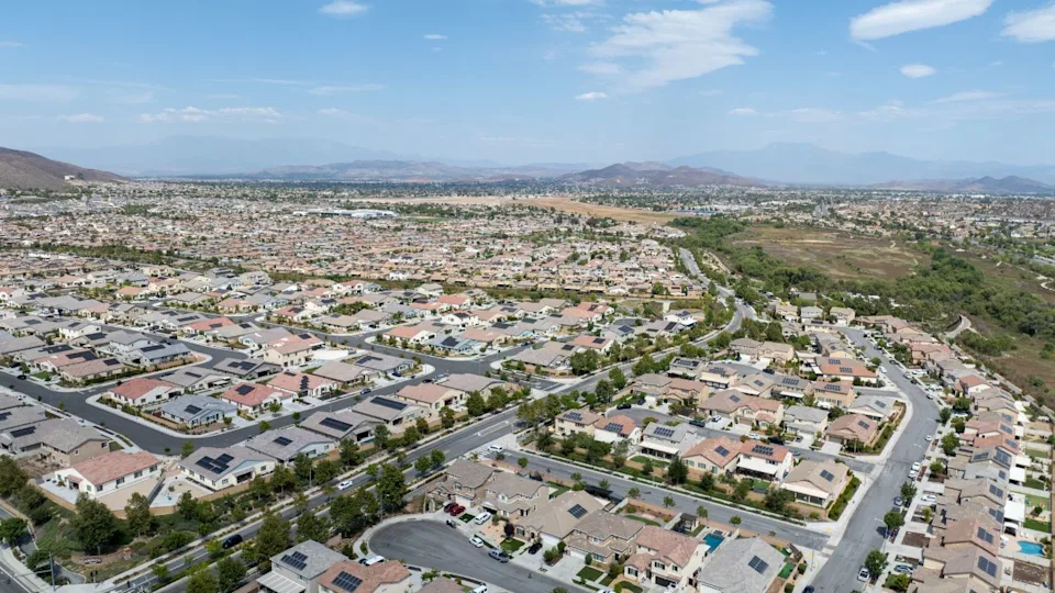 Aerial view of a sprawling neighborhood of family homes in Menifee city in Riverside County, California, United States