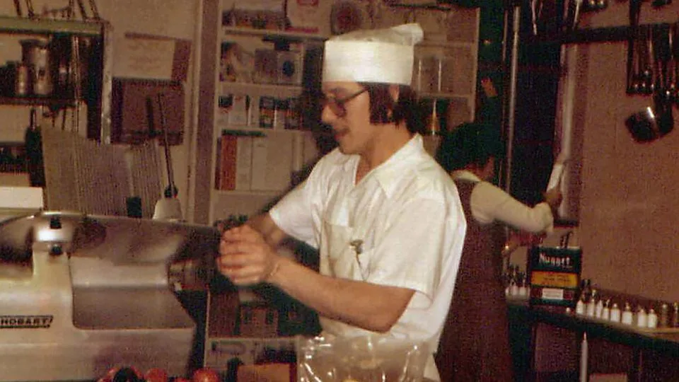 In November 1980, John worked on the catering team at MidAmerica Nazarene University in Kansas. Here he is working in the kitchen - Courtesy John Morris