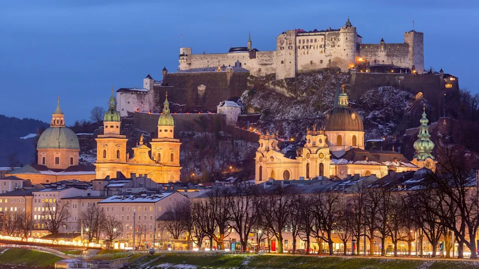 Sunset view of Salzburg with Hohensalzburg Fortress and Salzburg Cathedral, Austria.