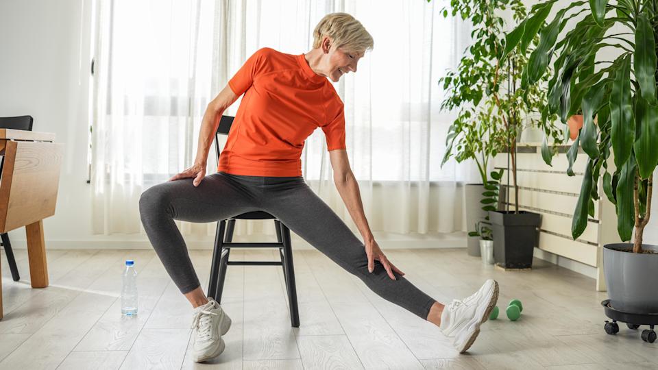 a senior woman doing a chair workout