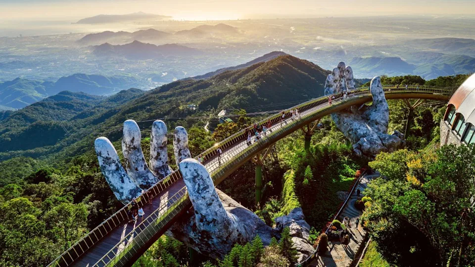 Tourist walking at Golden bridge in Bana hills, Da nang, Vietnam.