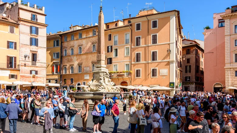 lots of tourists in a square in Italy