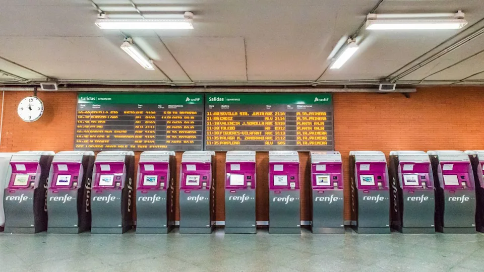 MADRID, SPAIN - JUNE 28, 2016: Ticket vending machines in Madrid Atocha railway station. It is the primary station of Madrid serving commuter, intercity, regional, and the AVE high speed trains.