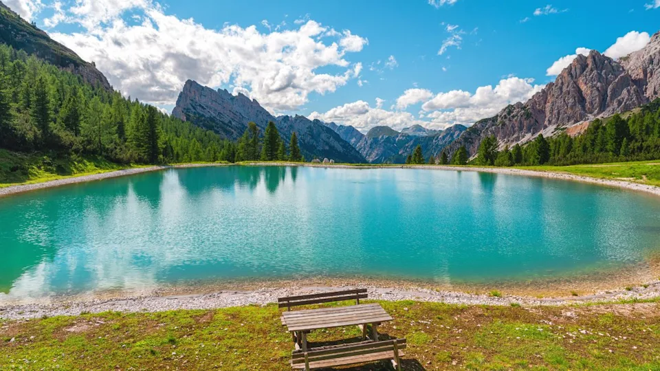 Turquoise water alpine lake in Dolomites mountains, Italy. Lago Son Forca in Italian Alps in sunny day, Summer vacation destination