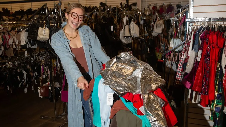 Andolyn Parrish, 28, from Nashville, poses with her shopping cart at the Unclaimed Baggage store. - Austin Steele/CNN