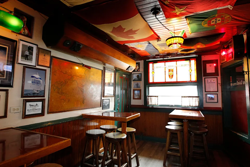 A variety of flags from around the world hang from the ceiling of Wolski's, 1836 N. Pulaski St. Many are gifts from patrons.