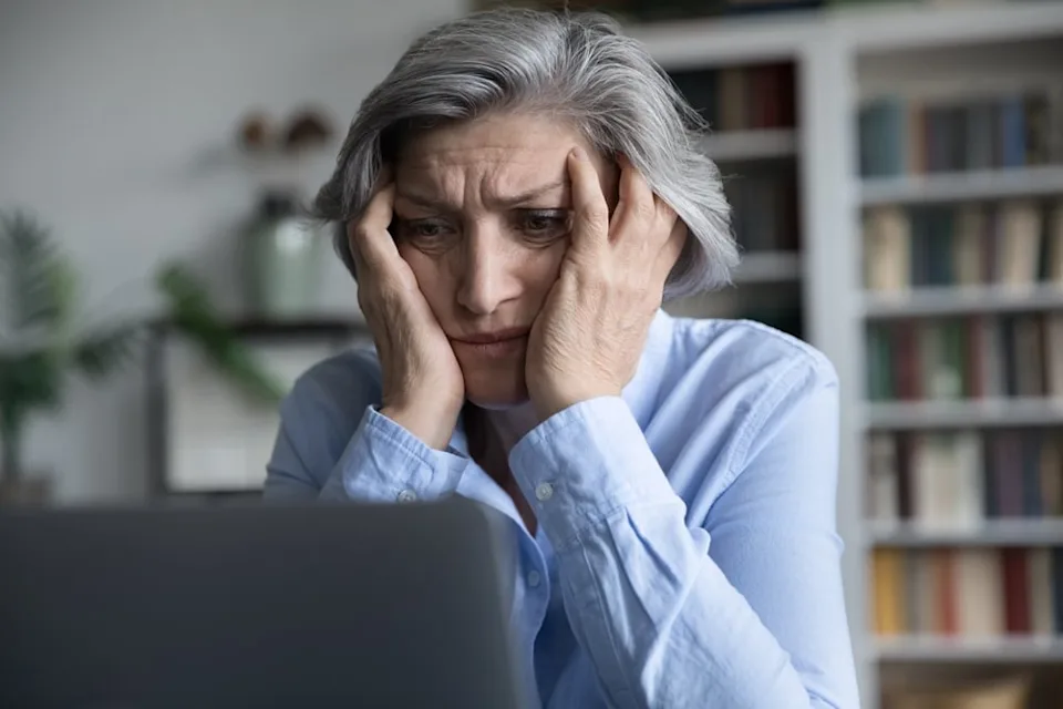 Frustrated senior on a computer.