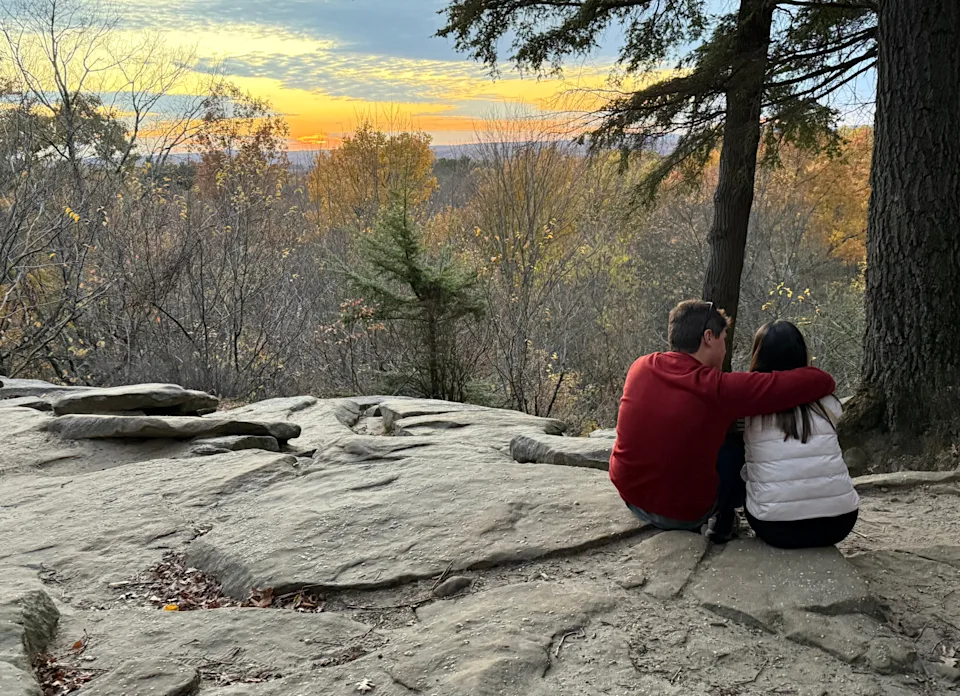 A couple enjoys a view of the sunset at The Ledges at Cuyahoga Valley National Park in Northeast Ohio.