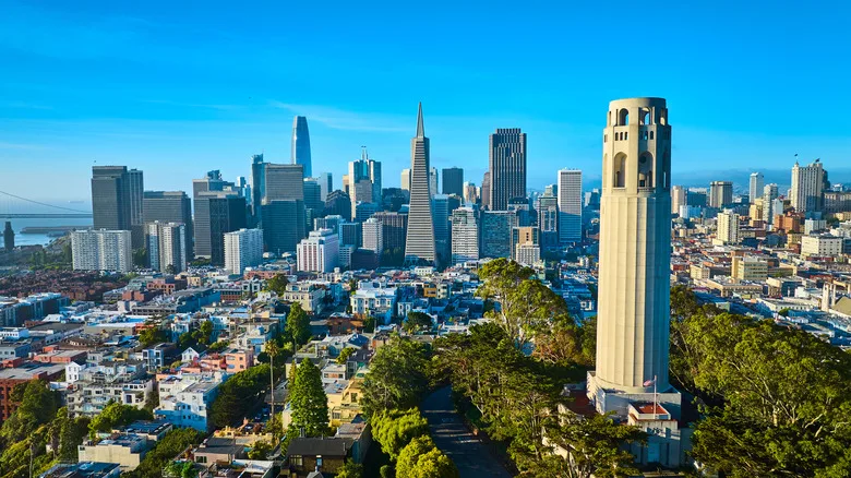 Aerial view of Coit Tower and the San Francisco skyline on a sunny day
