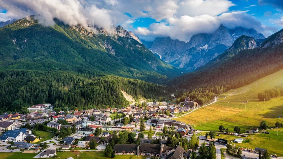 Kranjska Gora town in Slovenia at summer with beautiful nature and mountains in the background. View of mountain landscape next to Kranjska Gora in Slovenia, view from the top the town Kranjska Gora.