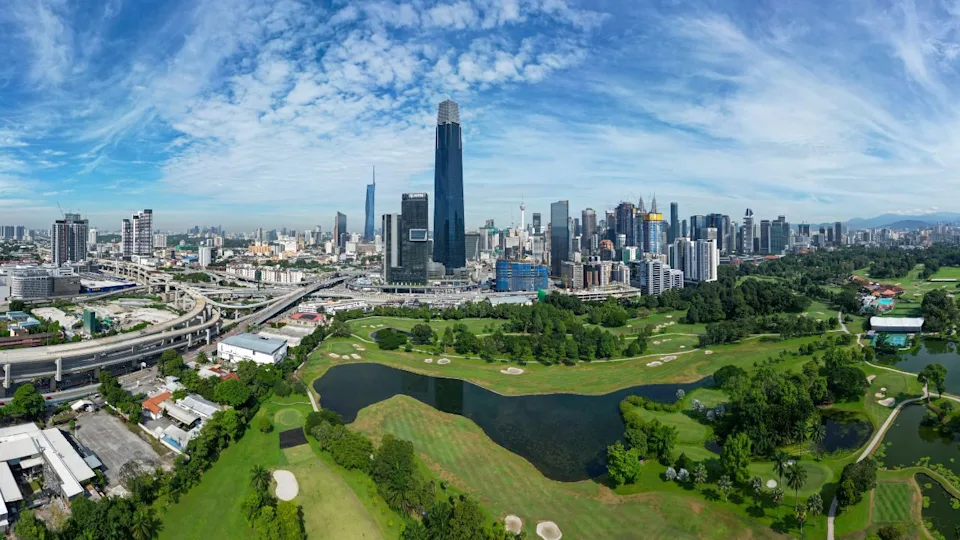Kuala Lumpur, Malaysia - 26th Sept 2022 : Beautiful areal view of Kuala Lumpur, the capital city of Malaysia in early morning with cloudy blue sky