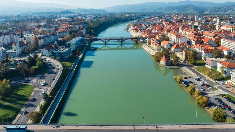 Amazing panoramic view of Maribor old town with bridges and the red roofed houses along Drava river in Slovenia