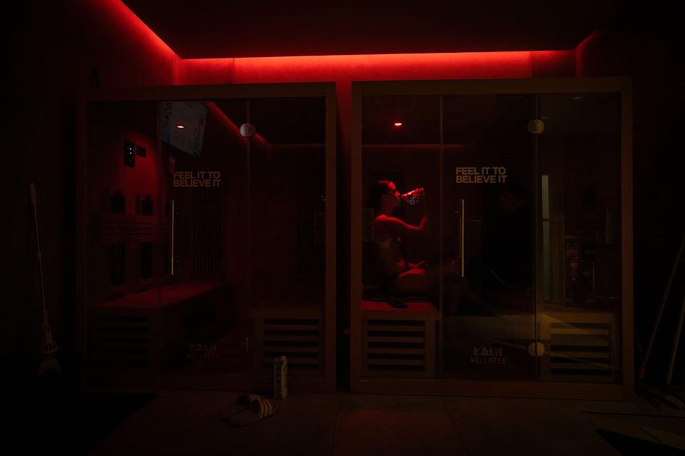 Sydney Swans AFLW player Chloe Molloy uses an infrared sauna in August in Sydney, Australia.  Studies show that infrared saunas can help boost heart health and reduce blood pressure (Getty Images)