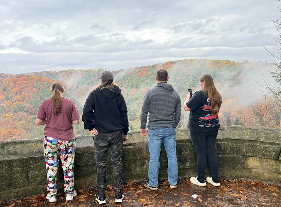 A family gazes out at Clearfork Gorge in November at Mohican State Park in Ashland County, one of the best hiking destinations in Northeast Ohio.