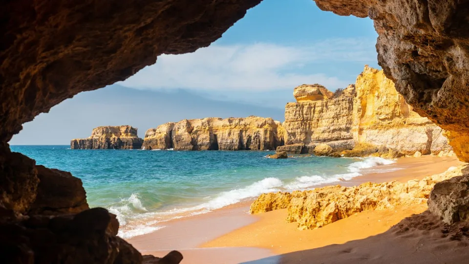 A natural summer beach cave at Praia da Coelha, Algarve, Albufeira. Portugal