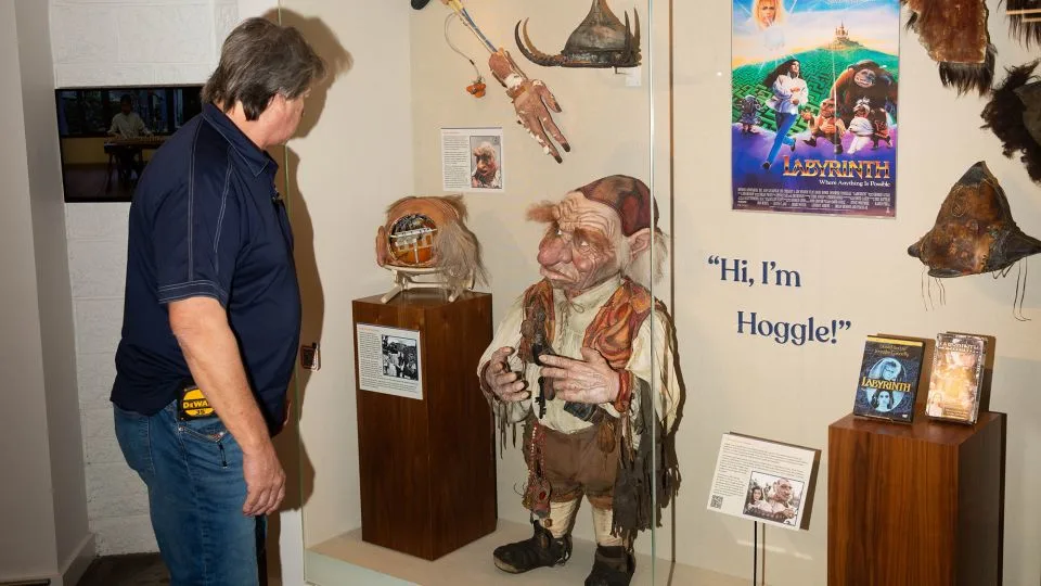 A museum inside the store showcases quirky items found in suitcases over the years, like this refurbished Hoggle puppet from the film set of “Labyrinth.” - Austin Steele/CNN