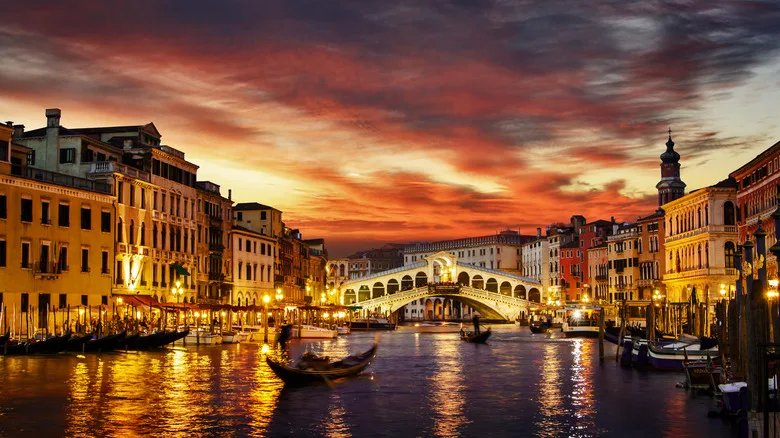 Venice at night with a pink sunset sky