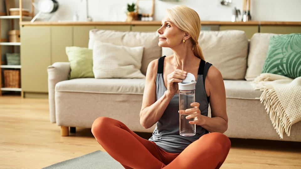 a senior woman on an exercise mat
