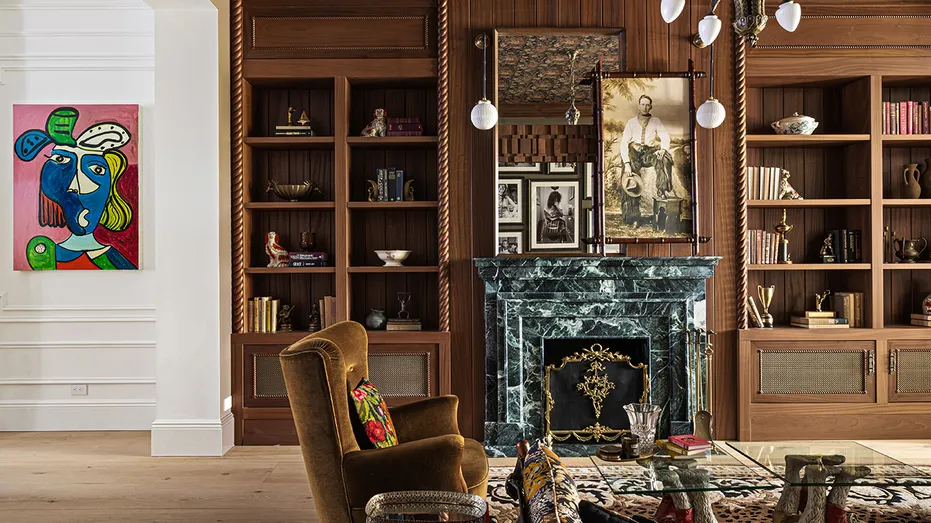 The home also features a secondary sitting room with a fireplace and built-in shelves.