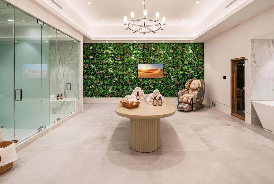 Guests can enjoy a zero-gravity massage chair, cold plunge, sauna, steam room, Peloton bike, treadmill, and a fully equipped gym. 